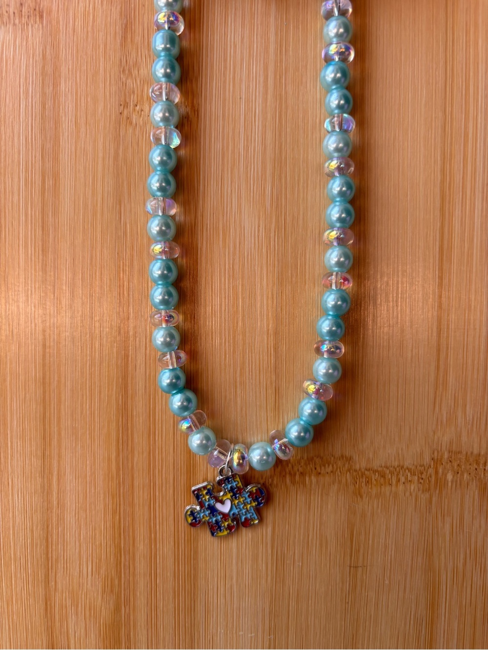 Blue Pearl Beaded Necklace with Multicolor Autism Awareness Puzzle Pendant